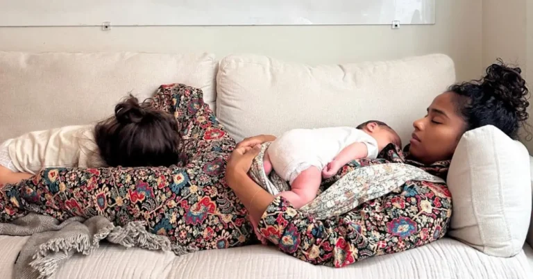 young mother with her two children on a couch